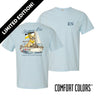Light blue Comfort Colors t-shirt shown front and back; front features small Greek letters on the left chest, back displays a golden retriever sailing a boat with script text above and “Chasing Open Water” below.